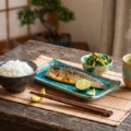 Traditional Japanese meal with grilled fish and rice for B1 English listening practice on Listenglish.