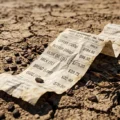 Grocery receipt with high prices on cracked earth, teaching climate change and inflation vocabulary on Listenglish.